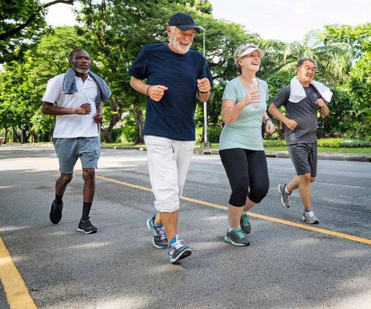 group of four healthy seniors exercising